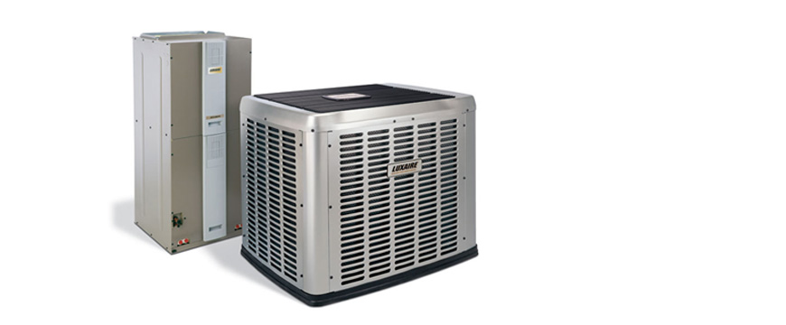 Image of a husband and wife with their children laughing.